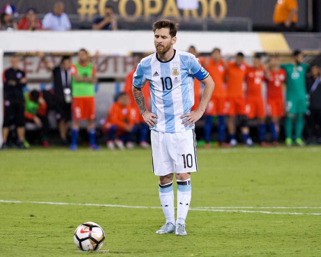 Argentina's Lionel Messi stares at the ball moments before missing his attempt during the penalty-kick shootout.